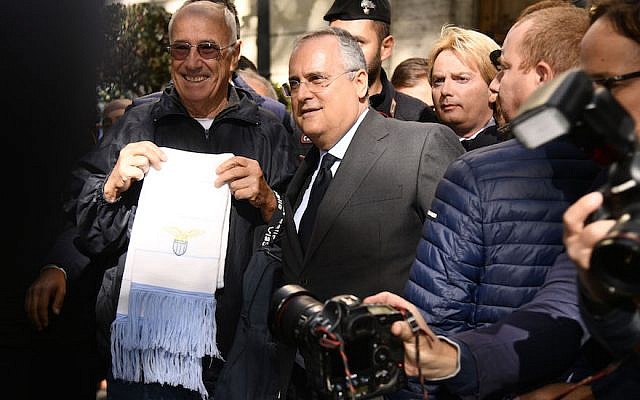 Lazio President Claudio Lotito visits Rome's Synagogue on October 24, 2017 in Rome, Italy. The visit comes after Lazio fans left anti-Semitic graffiti and stickers, some featuring Anne Frank wearing the shirt of rivals AS Roma, during their Serie A match against Cagliari. (Photo by Marco Rosi/Getty Images via JTA) Lazio President Claudio Lotito visits Rome's Synagogue on October 24, 2017 in Rome, Italy. The visit comes after Lazio fans left anti-Semitic graffiti and stickers, some featuring Anne Frank wearing the shirt of rivals AS Roma, during their Serie A match against Cagliari. (Photo by Marco Rosi/Getty Images via JTA)
