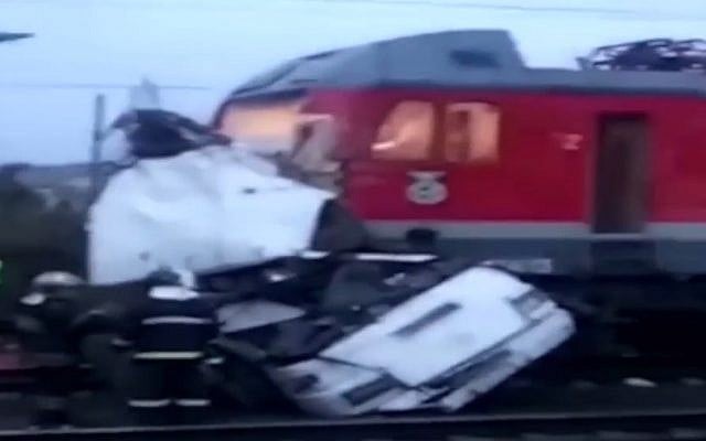 Aftermath of a train smashed into a bus which had broken down at level crossing in Russia, October 6, 2017. (Screen capture: YouTube) Aftermath of a train smashed into a bus which had broken down at level crossing in Russia, October 6, 2017. (Screen capture: YouTube)