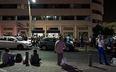 The line late at night outside the office of the Population Immigration and Borders Authority, September 29, 2017. (Luke Tress/Times of Israel)