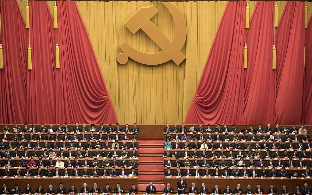 Chinese President Xi Jinping, center, presides over the opening ceremony of the 19th Party Congress held at the Great Hall of the People in Beijing Wednesday, Oct. 18, 2017. (AP Photo/Ng Han Guan)