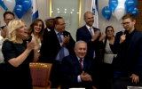 Yair Netanyahu (R) speaking during a 68th birthday party for his father, Prime Minister Benjamin Netanyahu (C), October 26, 2017. (Screen capture: YouTube)