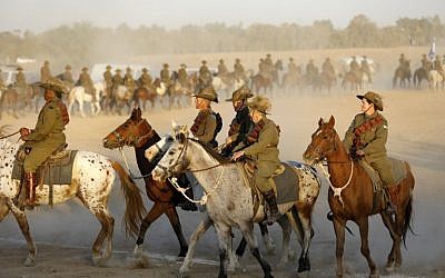 Members of the Australian Light Horse association ride near Beersheba in the southern Israeli desert on October 31, 2017 during a centennial reenactment of the historical fight of the ANZAC (Australian and New Zealand Mounted Division), which captured the area from the Ottoman Empire during the First World War. (AFP PHOTO / MENAHEM KAHANA)