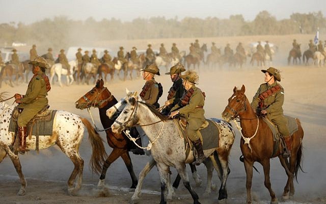 Members of the Australian Light Horse association ride near Beersheba in the southern Israeli desert on October 31, 2017 during a centennial reenactment of the historical fight of the ANZAC (Australian and New Zealand Mounted Division), which captured the area from the Ottoman Empire during the First World War. (AFP PHOTO / MENAHEM KAHANA)