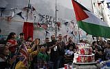 Palestinian children from the Aida refugee camp attend an event held by secretive British street artist Banksy to apologize for the 100th anniversary of the Balfour Declaration, on November 1, 2017, at his Walled-Off Hotel in Bethlehem in the West Bank. (AFP/Ahmad Gharabli)