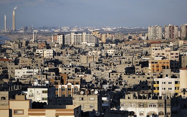 A picture taken on November 1, 2017, shows a general view of buildings in downtown Gaza City and the Israeli port city of Ashkelon in the background (AFP PHOTO / THOMAS COEX) A picture taken on November 1, 2017, shows a general view of buildings in downtown Gaza City and the Israeli port city of Ashkelon in the background (AFP PHOTO / THOMAS COEX)