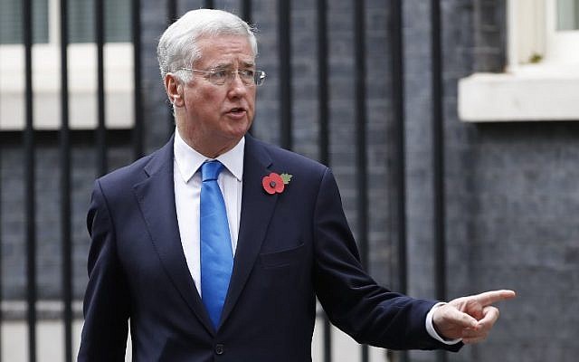 This file photo taken on October 31, 2017 shows Britain's Defense Secretary Michael Fallon leaving 10 Downing Street after the weekly meeting of the cabinet in central London. (AFP PHOTO / Tolga AKMEN)