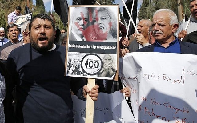 Demonstrators protest the 100th anniversary of Balfour Declaration outside the British Consulate in East Jerusalem, on November 2, 2017. (Ahmad Gharabli/AFP) Demonstrators protest the 100th anniversary of Balfour Declaration outside the British Consulate in East Jerusalem, on November 2, 2017. (Ahmad Gharabli/AFP)
