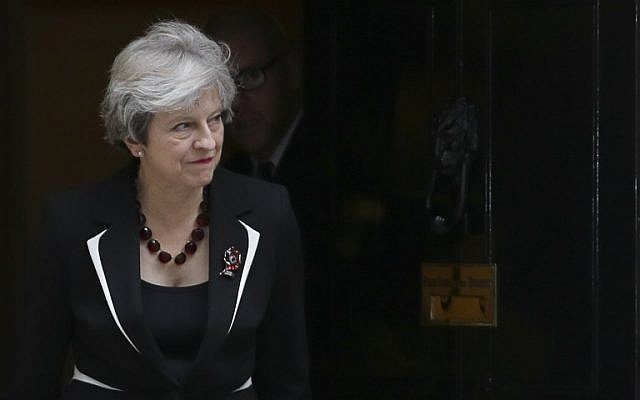 British Prime Minister Theresa May walks out of 10 Downing street to greet Israeli Prime Minister Benjamin Netanyahu in London on November 2, 2017.(AFP PHOTO / Daniel LEAL-OLIVAS) British Prime Minister Theresa May walks out of 10 Downing street to greet Israeli Prime Minister Benjamin Netanyahu in London on November 2, 2017.(AFP PHOTO / Daniel LEAL-OLIVAS)