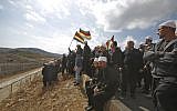 Druze men in the Israeli Golan Heights congregate near the Syrian border, waving their community's flag, after they heard about a suicide bombing in the Syrian Druze village of Hadar, on November 3, 2017. (Jalaa Marey/AFP)