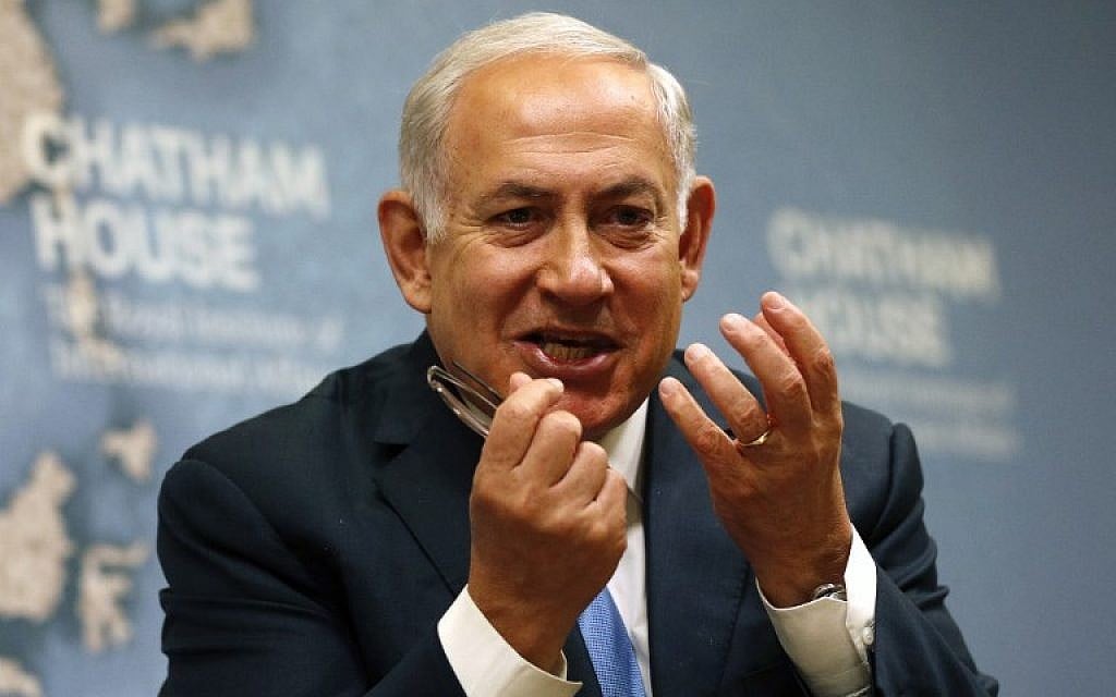 Prime Minister Benjamin Netanyahu gestures while giving a lecture regarding Israel's foreign policy priorities at Chatham House, The Royal Institute of International Affairs, in London November 3, 2017. (ADRIAN DENNIS / AFP)