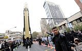 Iranians gather next to a replica of a medium-range ballistic missile during a demonstration outside the former US embassy in the Iranian capital Tehran on November 4, 2017, marking the anniversary of its storming by student protesters that triggered a hostage crisis in 1979. (AFP Photo/Atta Kenare)