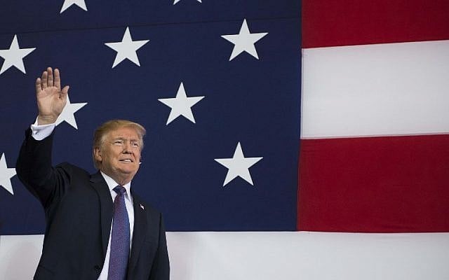 US President Donald Trump waves as he arrives to speak to US military personnel at Yokota Air Base at Fussa in Tokyo on November 5, 2017. (AFP PHOTO / JIM WATSON) US President Donald Trump waves as he arrives to speak to US military personnel at Yokota Air Base at Fussa in Tokyo on November 5, 2017. (AFP PHOTO / JIM WATSON)