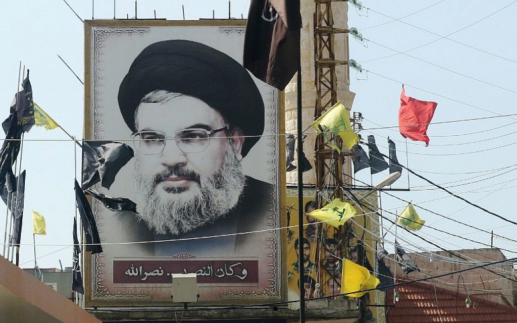 A portrait of the head of the Hezbollah terror group Hassan Nasrallah is seen on November 5, 2017, in the southern Lebanese village of Adshit. (AFP Photo/Mahmoud Zayyat)