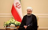 Iranian President Hassan Rouhani sits during a meeting with Pakistan Army Chief General in Tehran on November 6, 2017. (AFP/Atta Kenare)