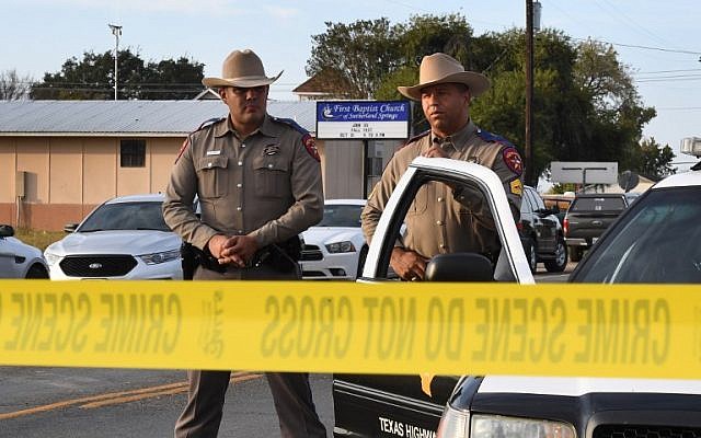 State troopers guard the entrance to the First Baptist Church (back), on November 6, 2017, after a mass shooting that killed 26 people in Sutherland Springs, Texas. (AFP Photo/Mark Ralston) State troopers guard the entrance to the First Baptist Church (back), on November 6, 2017, after a mass shooting that killed 26 people in Sutherland Springs, Texas. (AFP Photo/Mark Ralston)