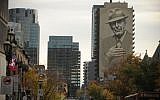 A mural of musician Leonard Cohen seen on a building in downtown Montreal, November 7, 2017. (AFP/Marc Braibant)