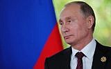 Russia's President Vladimir Putin speaks to the media during the Asia-Pacific Economic Cooperation (APEC) leaders' summit in the central Vietnamese city of Danang on November 11, 2017. (AFP/SPUTNIK/Mikhail KLIMENTYEV)