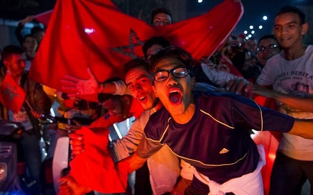 Moroccans celebrate November 11, 2017 in Marrakech following Morocco's victory over Ivory Coast in their FIFA 2018 World Cup Africa Qualifier to participate the FIFA 2018 World Cup. (AFP PHOTO / Fadel SENNA) Moroccans celebrate November 11, 2017 in Marrakech following Morocco's victory over Ivory Coast in their FIFA 2018 World Cup Africa Qualifier to participate the FIFA 2018 World Cup. (AFP PHOTO / Fadel SENNA)