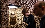 A milk jug on display at the Permanent Exhibition 'What We Were Unable To Shout Out To The World' of the underground archive of the Warsaw Ghetto, a few days before its public opening in the Jewish Historical Institute in Warsaw, November 13, 2017. (AFP/Wojtek RADWANSKI)