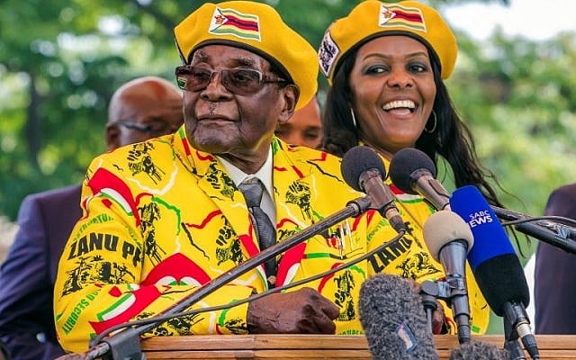 This photo taken on November 8, 2017 shows Zimbabwe's President Robert Mugabe (L) addressing party members and supporters gathered at his party headquarters to show support to Grace Mugabe (R) becoming the party's next Vice President after the dismissal of Emerson Mnangagwa. (AFP PHOTO / Jekesai NJIKIZANA) This photo taken on November 8, 2017 shows Zimbabwe's President Robert Mugabe (L) addressing party members and supporters gathered at his party headquarters to show support to Grace Mugabe (R) becoming the party's next Vice President after the dismissal of Emerson Mnangagwa. (AFP PHOTO / Jekesai NJIKIZANA)