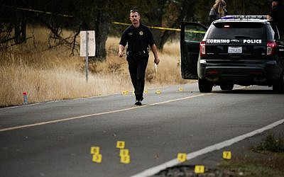 A law enforcement officer is seen at one of many crime scenes after a shooting on November 14, 2017, in Rancho Tehama, California. (AFP Photo/Elijah Nouvelage)