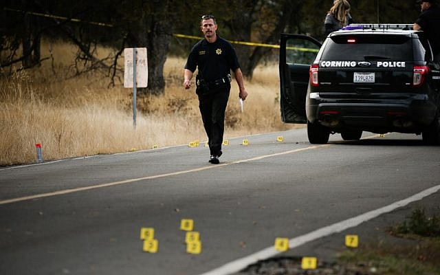 A law enforcement officer is seen at one of many crime scenes after a shooting on November 14, 2017, in Rancho Tehama, California. (AFP Photo/Elijah Nouvelage) A law enforcement officer is seen at one of many crime scenes after a shooting on November 14, 2017, in Rancho Tehama, California. (AFP Photo/Elijah Nouvelage)