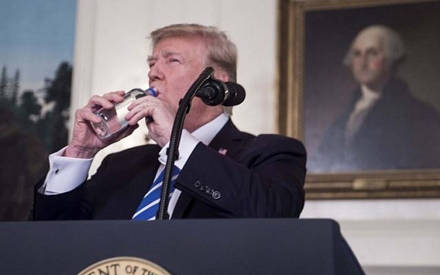 US President Donald Trump drinks water from a bottle as he delivers remarks on November 15, 2017 in the Diplomatic Room at the White House in Washington, DC. (AFP/NICHOLAS KAMM) US President Donald Trump drinks water from a bottle as he delivers remarks on November 15, 2017 in the Diplomatic Room at the White House in Washington, DC. (AFP/NICHOLAS KAMM)