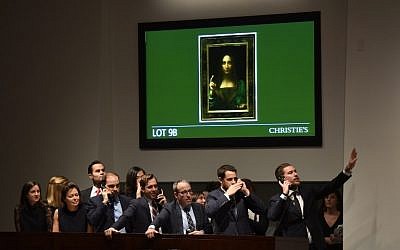 Christie's employees take bids for Leonardo da Vinci's "Salvator Mundi" at Christie's New York on November 15, 2017. (AFP/TIMOTHY A. CLARY)