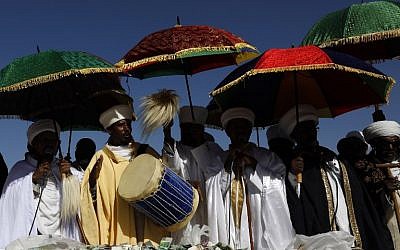 Israeli 'Kessim' or religious leaders of the Ethiopian Jewish community lead the prayers during the Sigd holiday marking the desire to 'return to Jerusalem', as they celebrate from a hilltop in the holy city, on November 16, 2017. (AFP PHOTO / GALI TIBBON)