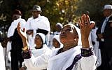 Illustrative: Israeli women from the Ethiopian Jewish community pray during the Sigd holiday marking the desire to 'return to Jerusalem,' as they celebrate from a hilltop in the holy city overlooking the Temple Mount, on November 16, 2017. (AFP Photo/Gali Tibbon)