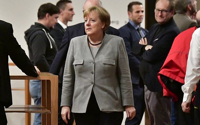 German Chancellor and leader of the Christian Democratic Union (CDU) party, Angela Merkel (C) is seen during a break in talks with members of potential coalition parties to form a new government on November 19, 2017 in Berlin. (AFP Photo/Tobias Schwartz) German Chancellor and leader of the Christian Democratic Union (CDU) party, Angela Merkel (C) is seen during a break in talks with members of potential coalition parties to form a new government on November 19, 2017 in Berlin. (AFP Photo/Tobias Schwartz)
