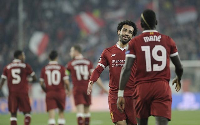 Liverpool's Egyptian midfielder Mohamed Salah (L) congratulates Senegalese midfielder Sadio Mane (R) after Mane scored a goal on November 21, 2017 at the Ramon Sanchez Pizjuan stadium in Sevilla during the UEFA Champions League group E football match between Sevilla FC and Liverpool FC. (AFP PHOTO / CRISTINA QUICLER) Liverpool's Egyptian midfielder Mohamed Salah (L) congratulates Senegalese midfielder Sadio Mane (R) after Mane scored a goal on November 21, 2017 at the Ramon Sanchez Pizjuan stadium in Sevilla during the UEFA Champions League group E football match between Sevilla FC and Liverpool FC. (AFP PHOTO / CRISTINA QUICLER)