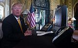 US President Donald Trump prepares his traditionnal adress to thank members of the US military via video teleconference on Thanksgiving day, from his residence in Mar-a-Lago in Florida, November 23, 2017. (AFP/Nicholas KAMM)