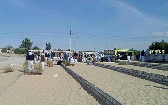 Egyptians gather outside the Rawda mosque, roughly 40 kilometers west of the North Sinai capital of El-Arish, following a gun and bombing attack, on November 24, 2017. (AFP PHOTO / STRINGER
