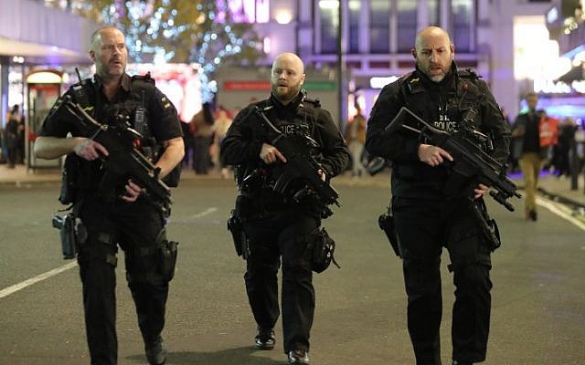 Illustrative: Armed police patrol near London's Oxford Street on November 24, 2017. (AFP Photo/Daniel Leal-Olivas) Illustrative: Armed police patrol near London's Oxford Street on November 24, 2017. (AFP Photo/Daniel Leal-Olivas)