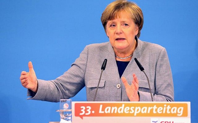 German Chancellor and leader of the Christian Democratic Union (CDU) party, Angela Merkel, gives a talk in her home state of Mecklenburg Western Pomerania, on November 25, 2017, in Kuehlungsborn, northern Germany. (AFP PHOTO / dpa / Bernd Wüstneck) German Chancellor and leader of the Christian Democratic Union (CDU) party, Angela Merkel, gives a talk in her home state of Mecklenburg Western Pomerania, on November 25, 2017, in Kuehlungsborn, northern Germany. (AFP PHOTO / dpa / Bernd Wüstneck)