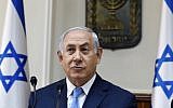 Prime Minister Benjamin Netanyahu opens the weekly cabinet meeting at his Jerusalem office on November 26, 2017. (AFP PHOTO / POOL / GALI TIBBON)