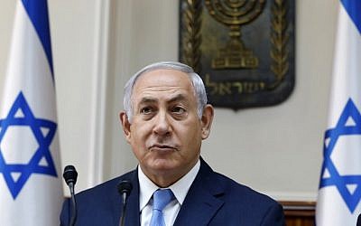 Prime Minister Benjamin Netanyahu opens the weekly cabinet meeting at his Jerusalem office, November 26, 2017. (AFP/GALI TIBBON) Prime Minister Benjamin Netanyahu opens the weekly cabinet meeting at his Jerusalem office, November 26, 2017. (AFP/GALI TIBBON)