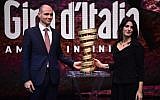 Israel's ambassador in Italy, Ofer Sachs, left, and the Mayor of Rome Virginia Raggi pose with the trophy of the Giro d'Italia during the presentation of the 2018 Tour of Italy (101st Giro d'Italia) cycling race, on November 29, 2017 in Milan.  (AFP/MARCO BERTORELLO)