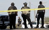 Law enforcement officials gather near the First Baptist Church following a shooting on November 5, 2017 in Sutherland Springs, Texas. Erich Schlegel/Getty Images/AFP)