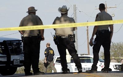 Law enforcement officials gather near the First Baptist Church following a shooting on November 5, 2017 in Sutherland Springs, Texas. Erich Schlegel/Getty Images/AFP)