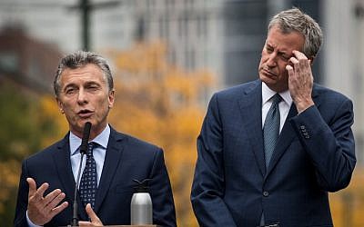 Argentinian President Mauricio Macri (L) speaks as New York City Mayor Bill de Blasio looks on during a tribute for the victims of last week's vehicular attack on the bike path next to the West Side Highway in Lower Manhattan, November 6, 2017 in New York City. (Drew Angerer/Getty Images via AFP)