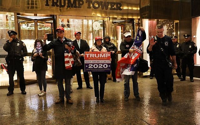A small group of supporters of Donald Trump outside of Trump Tower to mark the first year of Donald Trump's presidency on November 8, 2017 in New York City. (Spencer Platt/Getty Images/AFP) A small group of supporters of Donald Trump outside of Trump Tower to mark the first year of Donald Trump's presidency on November 8, 2017 in New York City. (Spencer Platt/Getty Images/AFP)
