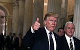 Accompanied by Vice President Mike Pence, Donald Trump, left, leaves the Capitol after he attended a House Republican Conference meeting November 16, 2017 in Washington, DC. (Alex Wong/Getty Images/AFP)