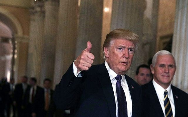 Accompanied by Vice President Mike Pence, Donald Trump, left, leaves the Capitol after he attended a House Republican Conference meeting November 16, 2017 in Washington, DC. (Alex Wong/Getty Images/AFP) Accompanied by Vice President Mike Pence, Donald Trump, left, leaves the Capitol after he attended a House Republican Conference meeting November 16, 2017 in Washington, DC. (Alex Wong/Getty Images/AFP)