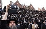 Hasidic rabbis prepare to pose a group photo, part of the annual International Conference of Chabad-Lubavitch Emissaries, in front of the group's World Headquarters, November 19, 2017, in Crown Heights, Brooklyn, New York. (Amir Levy/Getty Images/AFP)
