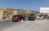 Israeli soldiers operate a checkpoint at the entrance to the village of Halhul, the hometown of a terrorist who rammed his car into two Israelis earlier in the day, on November 17, 2017. (Israel Defense Forces)