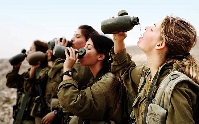 Illustrative: Female soldiers in the army's infantry instructors course take a water break during an exercise on November 19, 2007. (Israel Defense Forces) Illustrative: Female soldiers in the army's infantry instructors course take a water break during an exercise on November 19, 2007. (Israel Defense Forces)