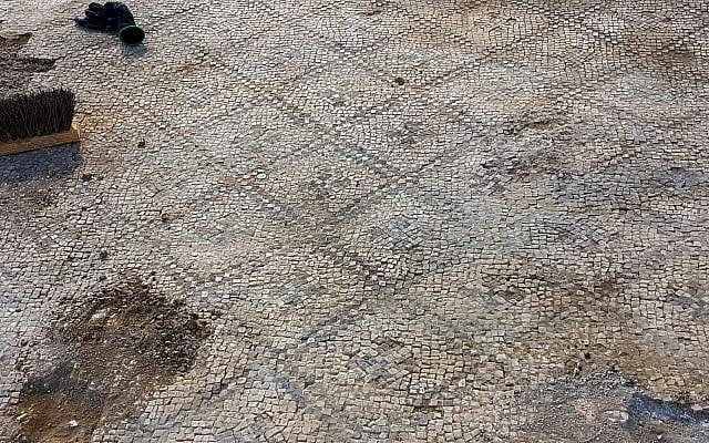 Working on the 1,500-year-old mosaic at Ashdod-Yam. (Anat Rasiuk, Israel Antiquities Authority)