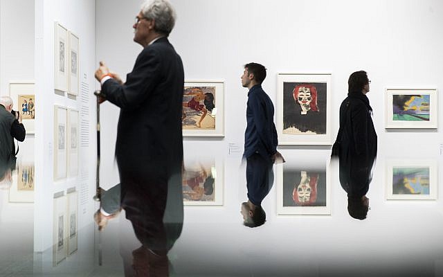 Visitors look at paintings in the exhibition 'Status Report Gurlitt. degenerate art - confiscated and sold' in the Kunstmuseum in Bern, Switzerland, November 1, 2017. (Peter Klaunzer/Keystone via AP) Visitors look at paintings in the exhibition 'Status Report Gurlitt. degenerate art - confiscated and sold' in the Kunstmuseum in Bern, Switzerland, November 1, 2017. (Peter Klaunzer/Keystone via AP)